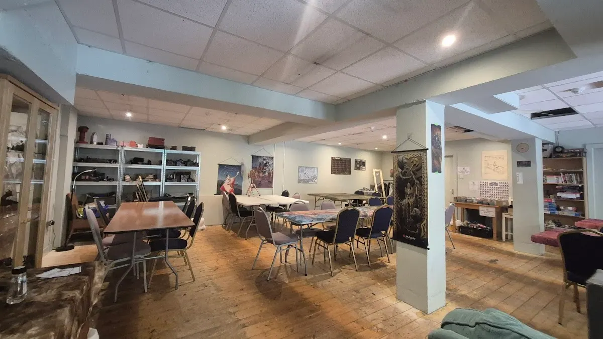 Upstairs gaming space with tables ready for game night